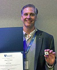 Brian Wirth with award and pin
