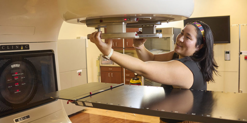 Graduate student Annette Robbins using medical machinery in her clinical trials