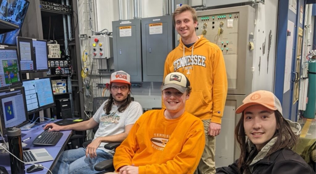 Picture of Lang group students at the Advanced Photon Source (from left to right: John Hirtz, Jacob Minnette (bottom), Evan Williams (top), Cale Overstreet)