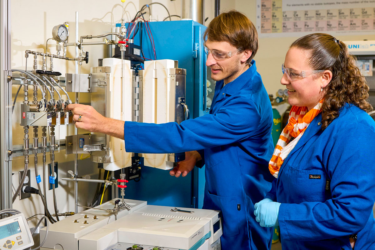 Kate Page working with a graduate student in a lab at IAMM