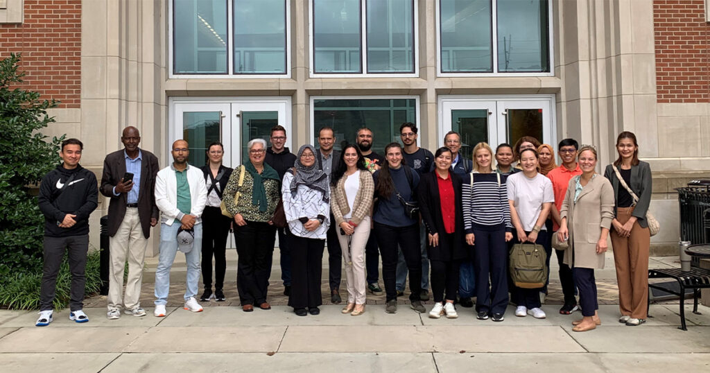 IAEA and ORNL class standing in front of Zeanah Engineering Complex building