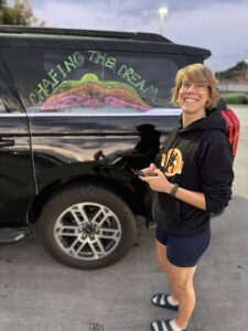 Sophie Blondel standing next to an SUV